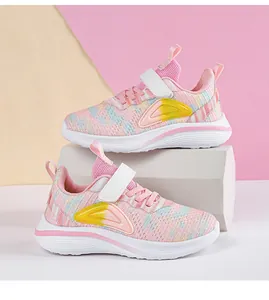 Close-up detail of pink pastel mesh sneakers for girls with durable white rubber soles.