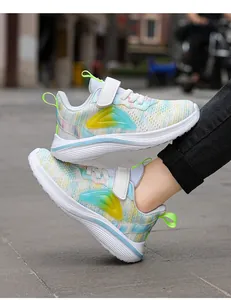 Close-up detail of girls colorful tie-dye mesh running shoes with secure Velcro straps