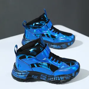 Trendy boys' high-top sneakers featuring metallic blue leather and graffiti patterns