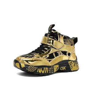 Shiny gold high-top sneakers for boys with graffiti sole and strap closure.