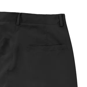 Detail view of the back pocket and waist belt loops on black men's casual cargo pants