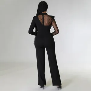 Combinaison chic noire à manches longues avec dos asymétrique en tulle à pois élégante.
