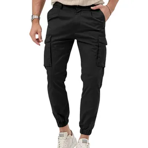 Detailed view of slim-fit black multi-pocket cargo joggers for men with elastic cuffs.