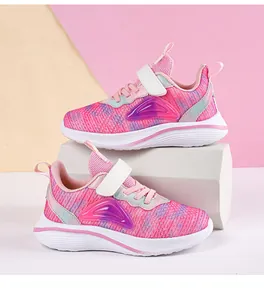 Professional side view of breathable pink mesh girls running shoes featuring a secure strap