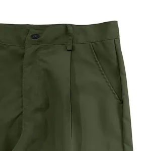 Detailed macro view of the waist and side pocket on men's olive green multi-pocket cargo pants.