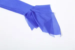 Macro shot of royal blue mesh ruffle detail on the sleeve cuff of a summer fashion top
