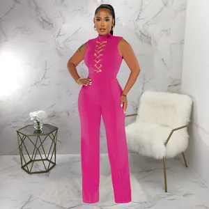Detailed view of the fuchsia pink sleeveless jumpsuit with chain lace-up detail