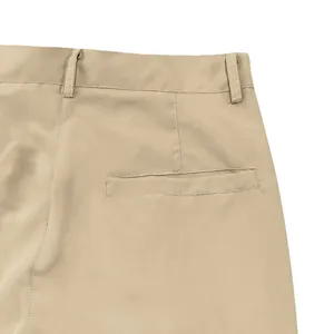 Close-up detail of khaki men's cargo pants showing waistband loops and back pocket.