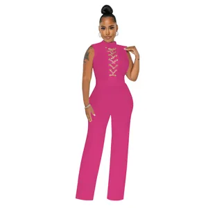 Detailed view of pink sleeveless jumpsuit featuring a sexy lace-up chest and wide-leg fit