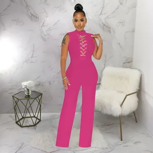Sexy vibrant pink sleeveless high neck jumpsuit with chest lace-up detail and wide legs