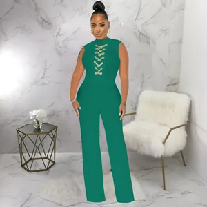 Elegant green sleeveless mock neck jumpsuit featuring wide legs and decorative front lace-up detail