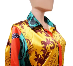 Detail close-up of a vibrant vintage baroque print long sleeve satin shirt for women