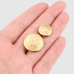 Premium high-end brass buttons featuring an embossed heraldic crest in a polished gold finish