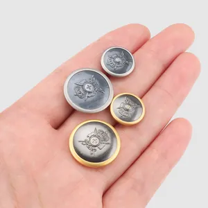 Premium brass metal buttons with embossed crown emblem for garment decoration