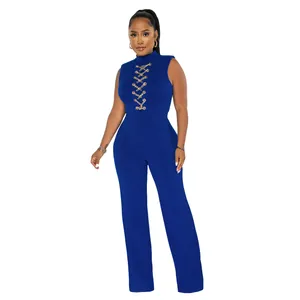 Elegant royal blue sleeveless high-neck jumpsuit featuring gold chain lace-up detail