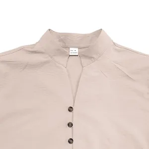 Detail of a men's retro beige shirt featuring a stand collar and button-up V-neck