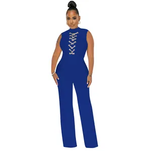 Front view of a sexy royal blue sleeveless high-neck wide-leg jumpsuit with lace-up detail