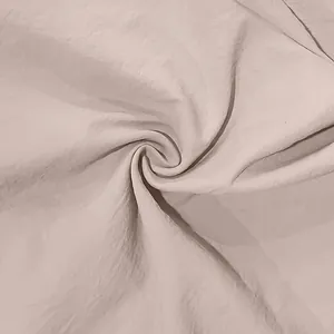 High-quality close-up detail of beige linen fabric texture for a vintage summer shirt material