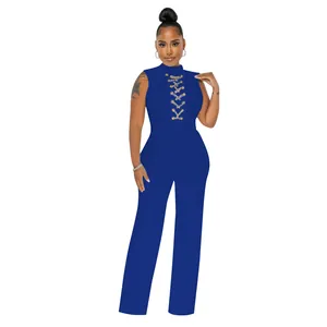 Royal blue sleeveless mock neck jumpsuit with gold chain lace-up chest detail