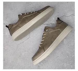 Close-up view of premium vintage men's brown leather skate shoes on concrete background