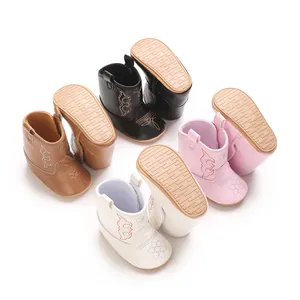 Detailed view of soft PU baby walking boots in four colors with non-slip outsoles