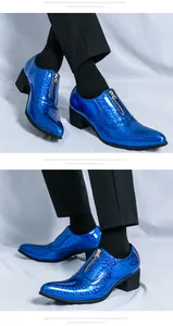 Stylish blue metallic pointed-toe men's dress shoes featuring zipper detail and thick heel