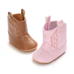 Detail view of soft PU baby walking boots in pink and brown with cute stitching.