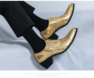 Detail of men's gold leopard print leather shoes with pointed toe and high heel.