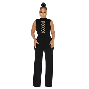 Detail view of black sleeveless wide leg jumpsuit with gold chain lace-up chest