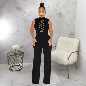 Elegant black sleeveless high-neck jumpsuit with gold chain lace-up and wide-leg pants