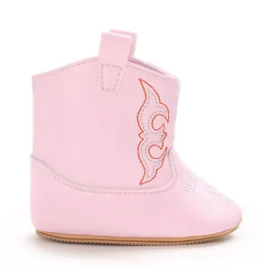 Side view of soft pink PU baby cowboy boot featuring intricate orange embroidery details