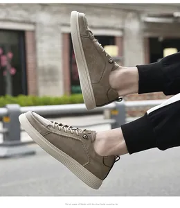 Side view of men's vintage brown leather sneakers on model in street setting