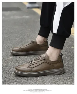 Detailed side view of men's stylish brown vintage leather shoes on asphalt ground
