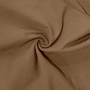 Close-up detail of high-quality brown linen fabric texture for a men's retro summer shirt