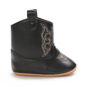 Detailed side view of black PU leather baby cowboy boots with decorative embroidery
