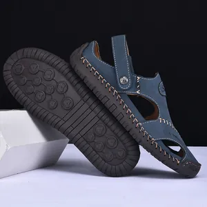 Close-up of blue leather men's outdoor sandals showing durable non-slip rubber sole