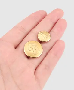Detail of high-end vintage gold brass buttons featuring an embossed heraldic lion design