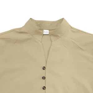 Close-up detail of a men's khaki stand collar shirt with V-neck and front buttons