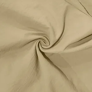 High-detail macro view of beige breathable linen fabric texture for a vintage men's shirt