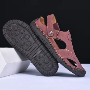 Detailed view of men's burgundy leather sandals featuring durable anti-slip rubber sole