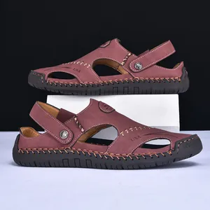 Detail view of men's reddish-brown leather sandals featuring durable hand-stitched soles