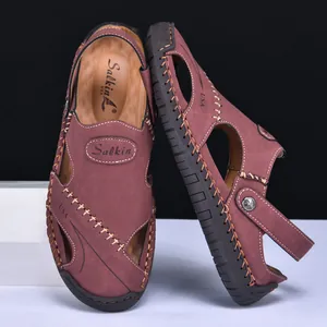 Detailed view of men's burgundy leather outdoor sandals with handcrafted stitching details