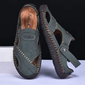 Close-up detail of durable men's leather sandals with hand-stitched seams and teal finish