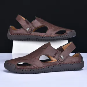 Detailed view of brown leather men's outdoor sandals with contrast stitching and dual-use strap