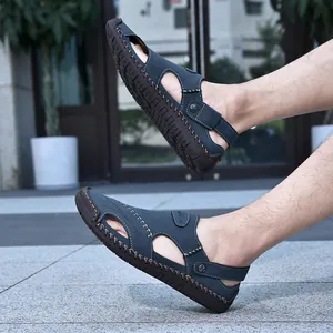 Detailed view of men's blue cowhide leather outdoor sandals featuring hand-stitched design