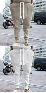 Detail of men's knit jacquard jogger pants featuring drawstring waist and textured fabric.