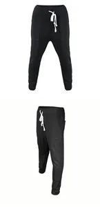 Detailed view of men's black jacquard trousers with textured pattern and drawstring waist