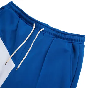 Close-up of elastic waistband and drawstring on blue color-block men's pants