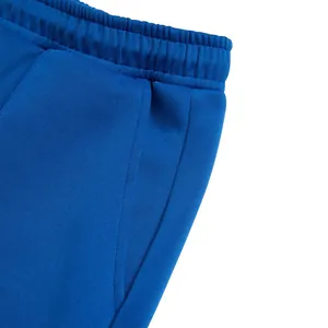 Detailed close-up of royal blue loose-fit casual sweatpants with elastic waistband