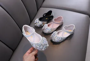 Sparkling rhinestone princess flat shoes for girls featuring a decorative butterfly bow.